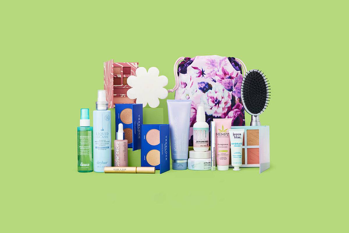A variety of beauty products, including skincare, makeup, and a floral bag, arranged against a vibrant green background.